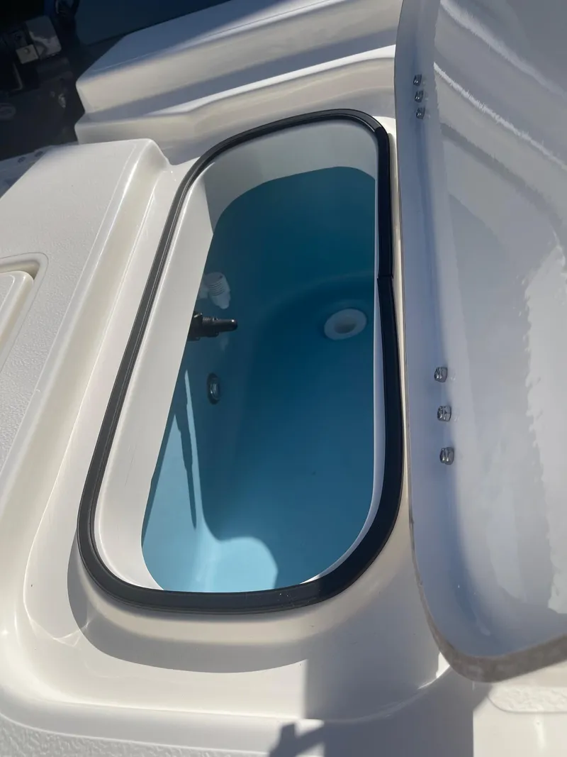 Slide: The Image of 2025 Skeeter SX221 capacity label: 6 persons or 878 lbs, 200 HP motor. - 11