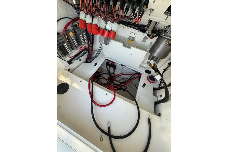 Slide: The Image of Electrical wiring and components inside a 2025 Skeeter SX221 boat. - 21