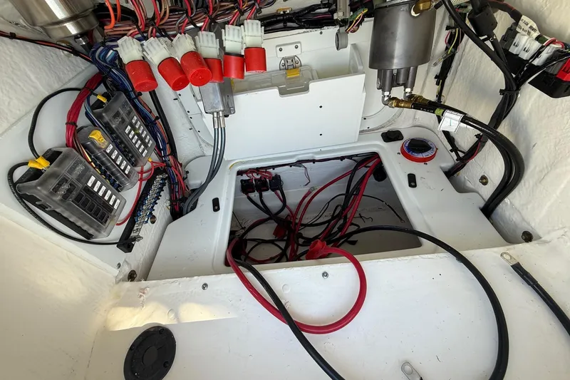Slide: The Image of Interior wiring of 2025 Skeeter SX221 boat, showcasing electrical components and connections. - 22