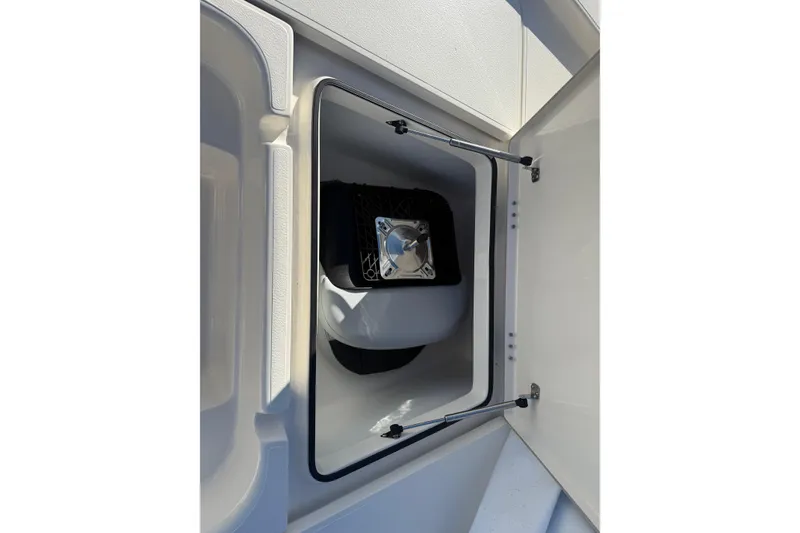 Slide: The Image of Open storage compartment on 2025 Skeeter SX221 boat, showcasing interior details. - 24