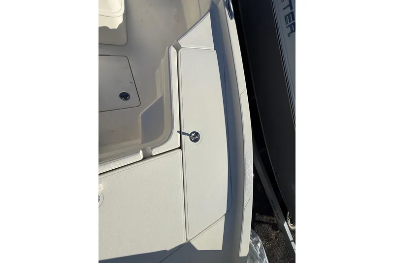 Slide: The Image of 2025 Skeeter SX221 boat deck with storage compartments and sleek design. - 26