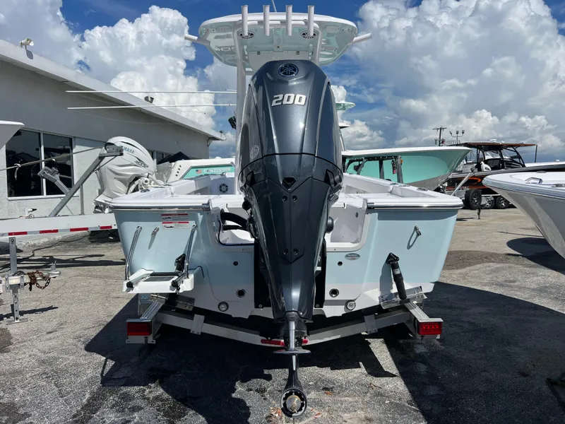 Slide: The Image of 2024 Sportsman Masters 227 Bay Boat with 200 HP engine, parked outdoors. - 13