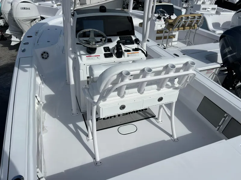 Slide: The Image of 2024 Sportsman Masters 227 Bay Boat interior with console and seating. - 5