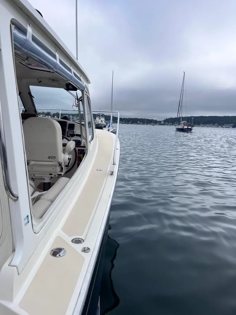 Slide: The Image of 2014 MJM 36z Downeast boat on calm water with overcast sky. - 32