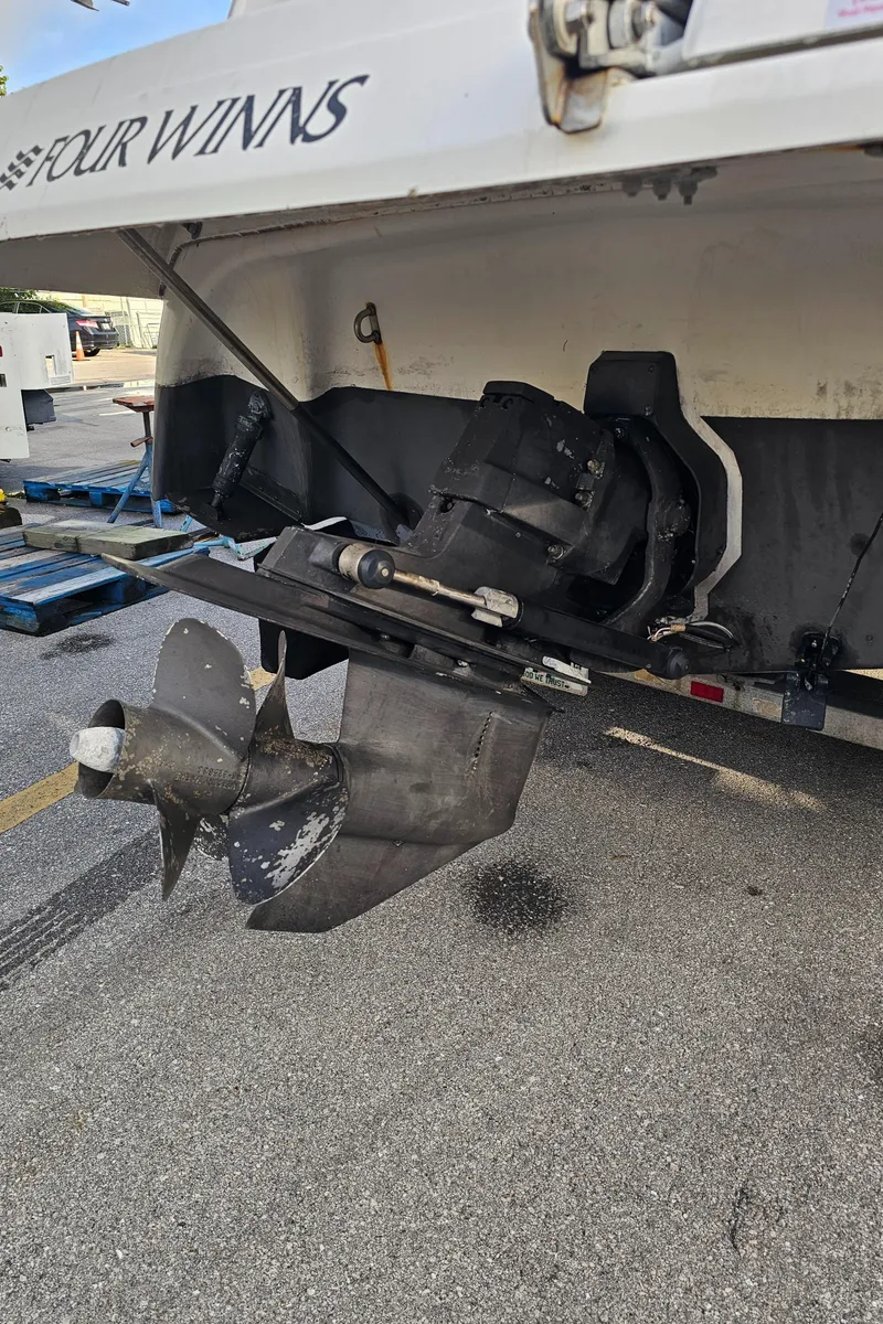 Slide: The Image of 2002 Four Winns 248 Vista boat propeller and stern drive detail. - 23