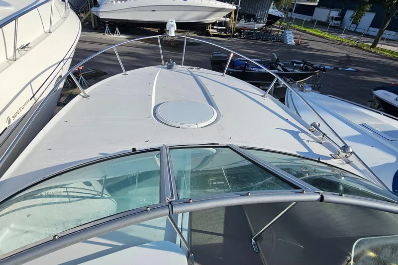 Slide: The Image of 2002 Four Winns 248 Vista boat deck with windshield and railing. - 4