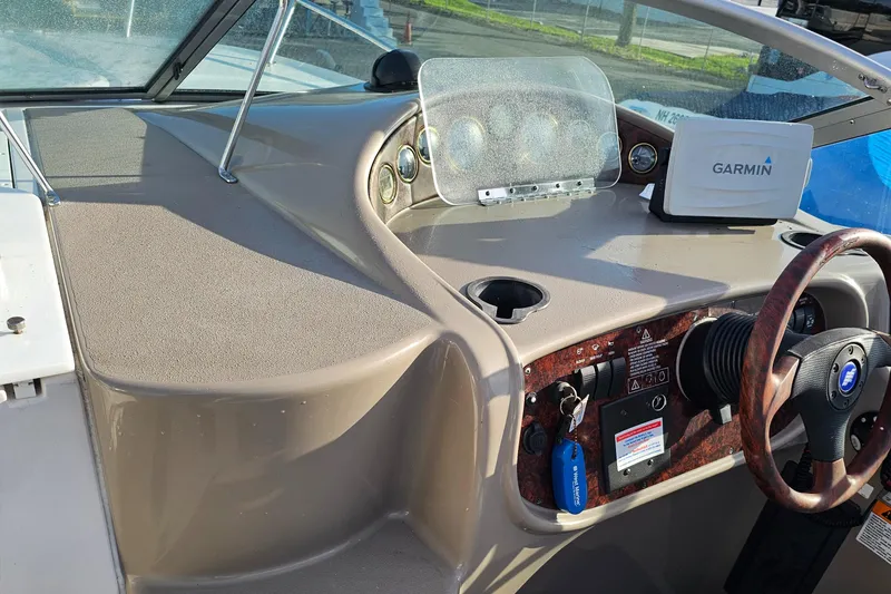 Slide: The Image of 2002 Four Winns 248 Vista boat dashboard with Garmin navigation system. - 5