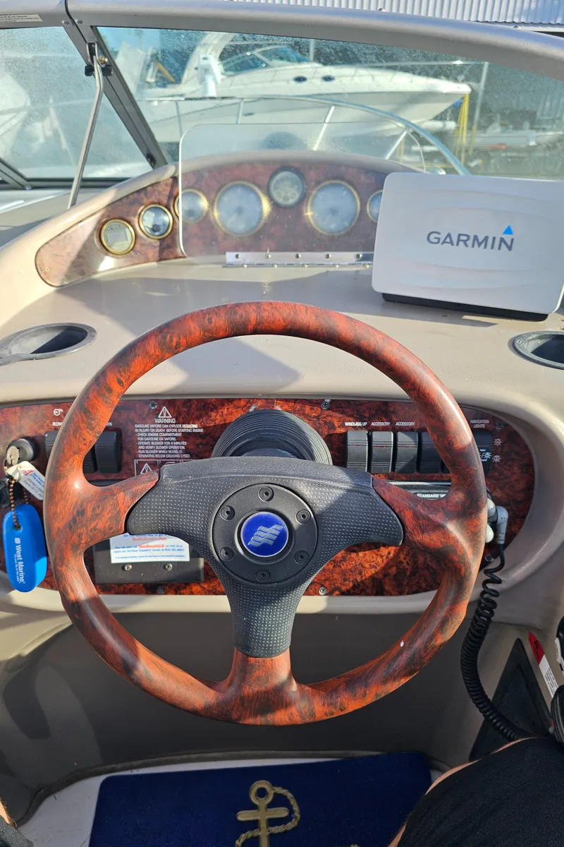 Slide: The Image of 2002 Four Winns 248 Vista boat dashboard with Garmin navigation system. - 8