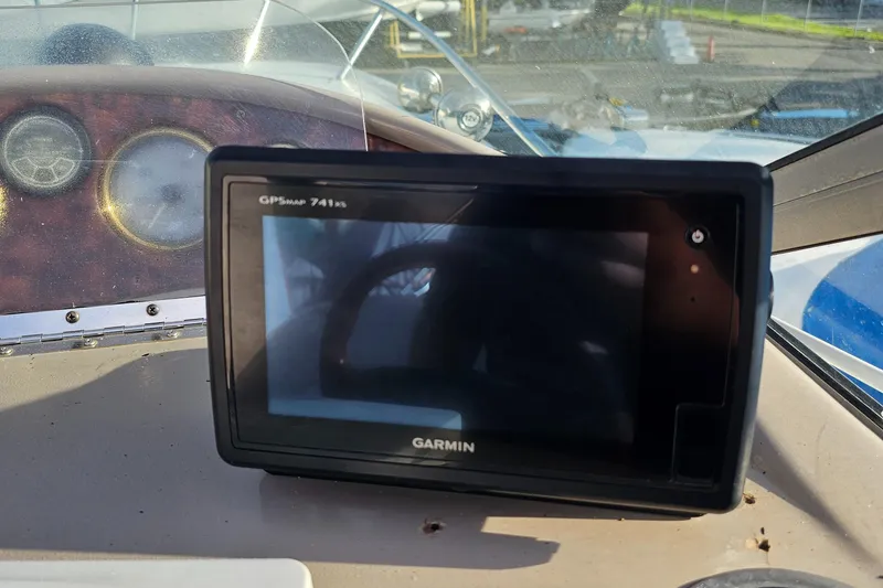 Slide: The Image of Garmin GPSmap 741xs on 2002 Four Winns 248 Vista boat dashboard. - 9