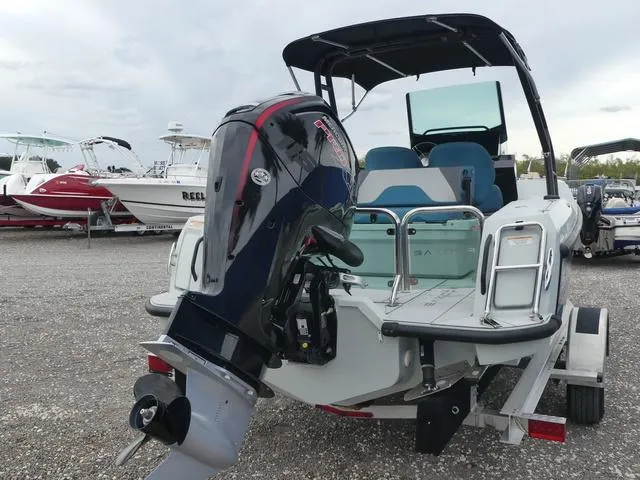 Slide: The Image of 2022 Saxdor SX 200 boat with outboard motor on a trailer. - 10