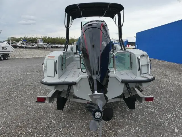 Slide: The Image of 2022 Saxdor SX 200 boat rear view with outboard motor on trailer. - 11