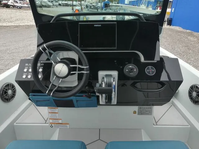 Slide: The Image of 2022 Saxdor SX 200 boat dashboard with steering wheel and controls. - 22