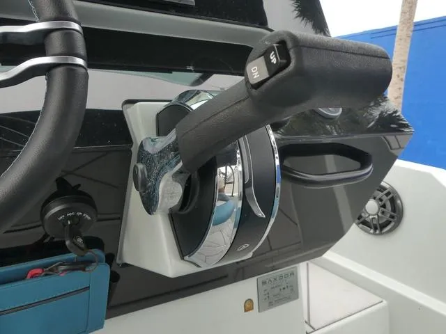 Slide: The Image of Throttle control of 2022 Saxdor SX 200 boat, featuring sleek design and modern controls. - 25