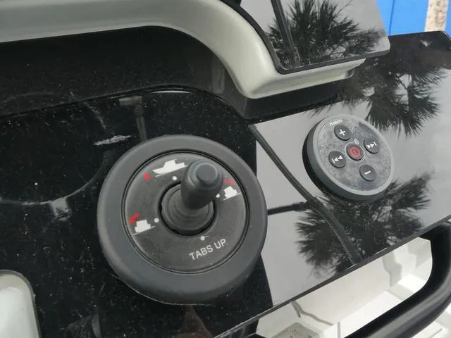 Slide: The Image of Close-up of 2022 Saxdor SX 200 boat controls with joystick and buttons. - 26