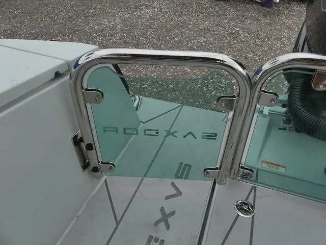 Slide: The Image of Saxdor SX 200 boat, 2022 model, featuring sleek glass and metal railing design. - 32