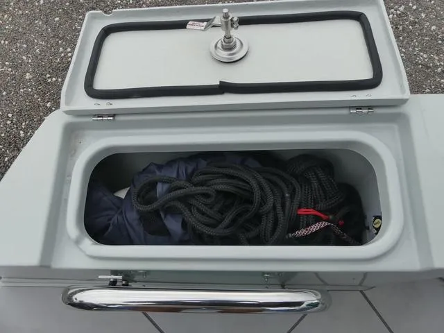 Slide: The Image of Storage compartment on 2022 Saxdor SX 200 boat with ropes and gear. - 36