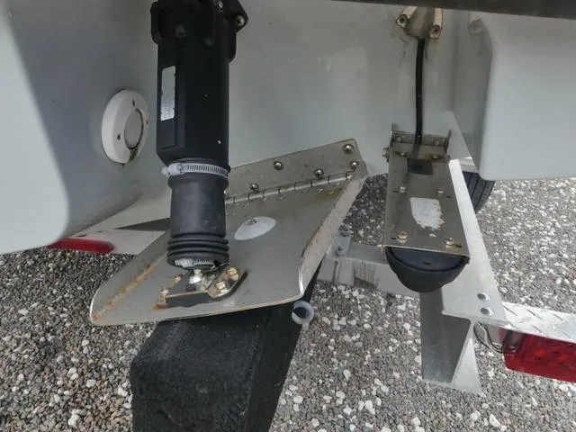 Slide: The Image of Close-up of 2022 Saxdor SX 200 boat's trim tab and motor components. - 42
