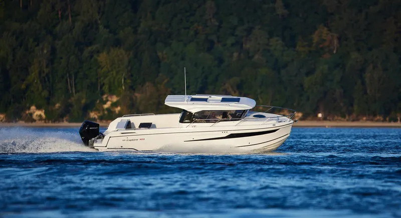 Slide: The Image of 2024 Skamander 920 Explorer MAX cruising on a scenic lake. - 29