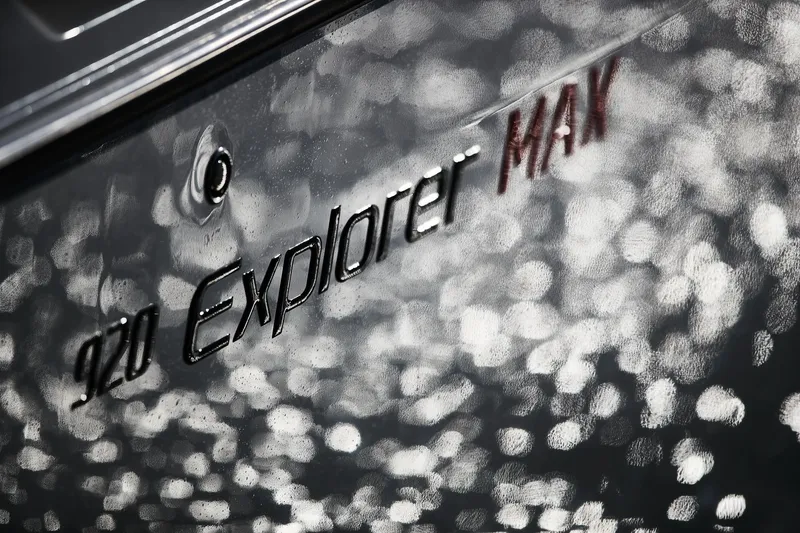 Slide: The Image of Close-up of 2024 Skamander 920 Explorer MAX logo on textured surface. - 30