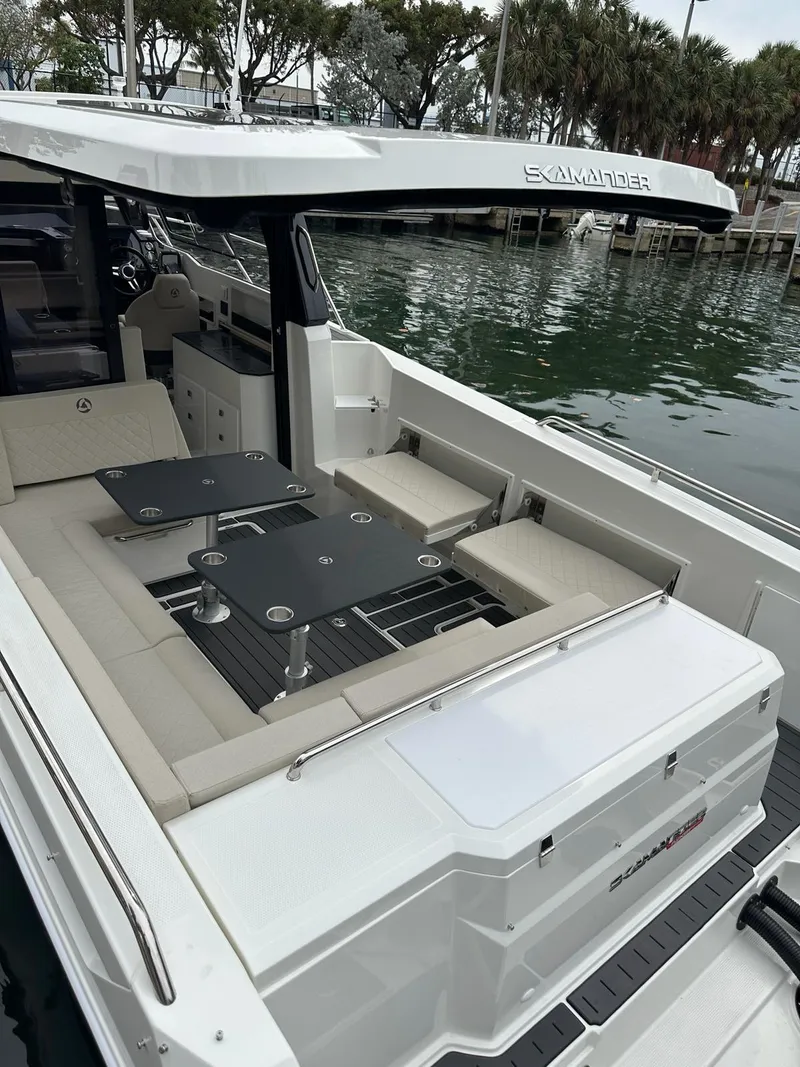 Slide: The Image of 2024 Skamander 920 Explorer MAX boat with spacious seating and sleek design. - 37