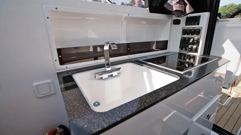 Slide: The Image of Modern kitchen area in 2024 Skamander 920 Explorer MAX boat. - 9