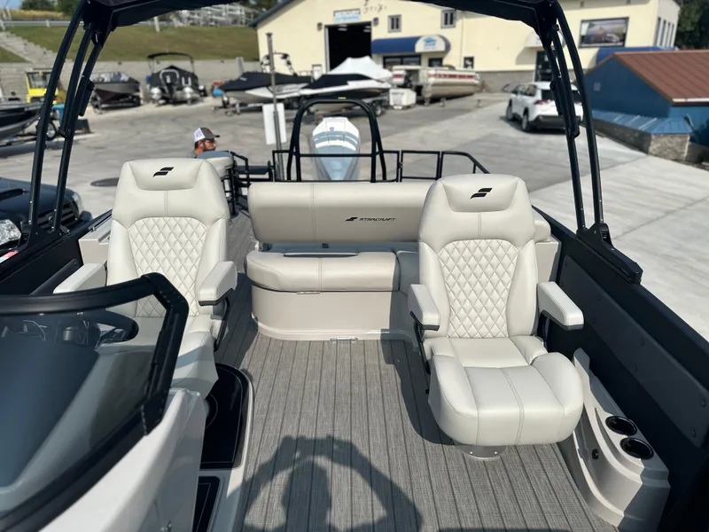 Slide: The Image of 2025 Starcraft RX 25 DL DC boat interior with luxurious seating and modern design. - 11