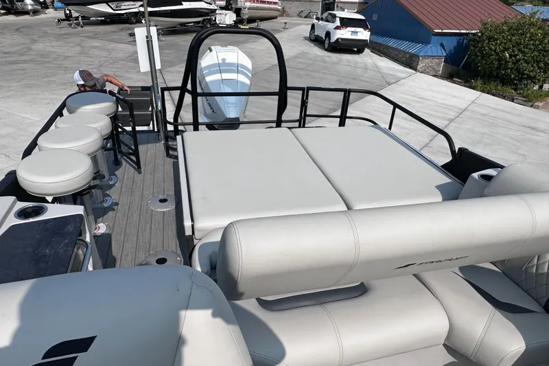 Slide: The Image of 2025 Starcraft RX 25 DL DC boat interior with seating and deck view. - 22