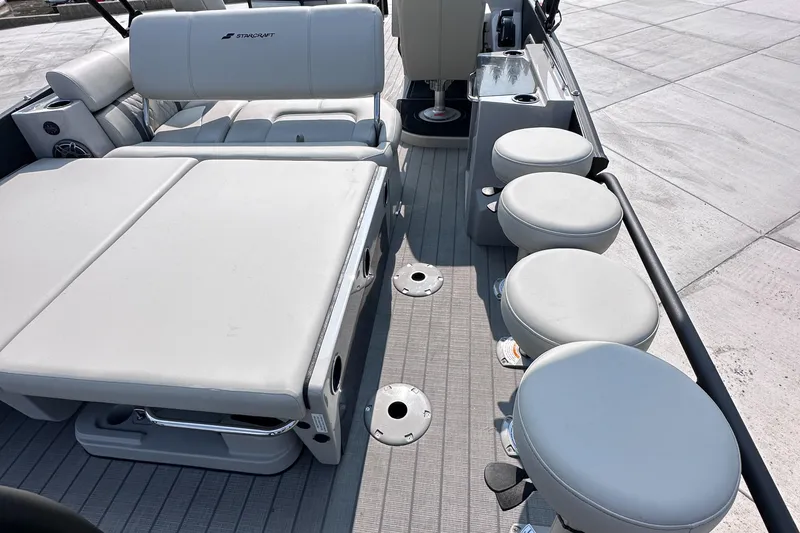 Slide: The Image of 2025 Starcraft RX 25 DL DC boat interior with plush seating and modern design. - 24