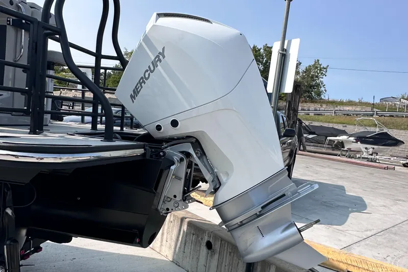 Slide: The Image of 2025 Starcraft RX 25 DL DC with Mercury outboard motor at dock. - 27