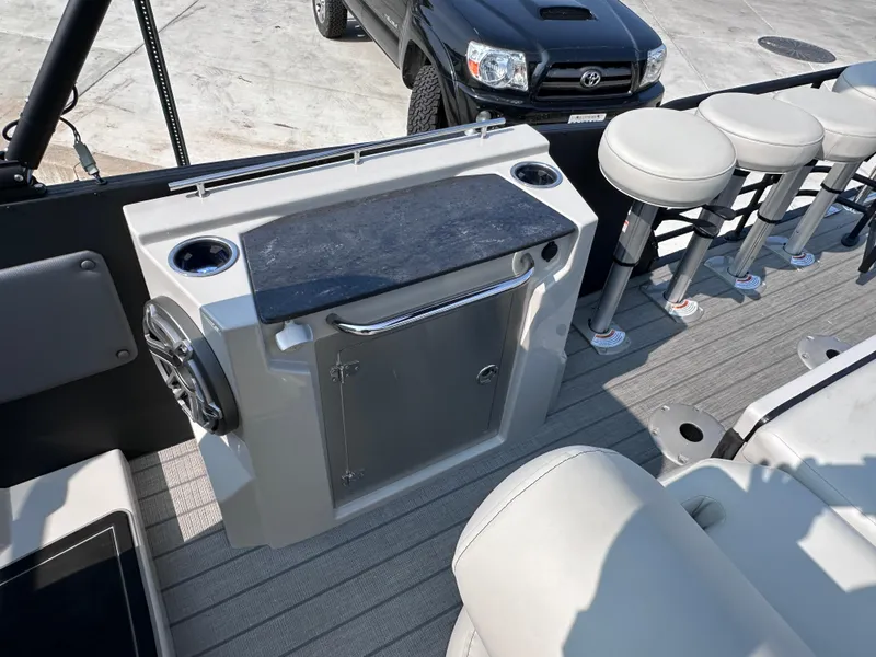 Slide: The Image of 2025 Starcraft RX 25 DL DC boat interior with seating and storage. - 7