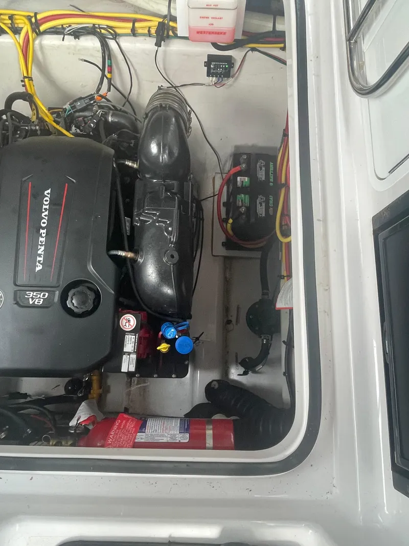 Slide: The Image of Engine compartment of 2019 Four Winns Vista 275 with Volvo Penta engine. - 27