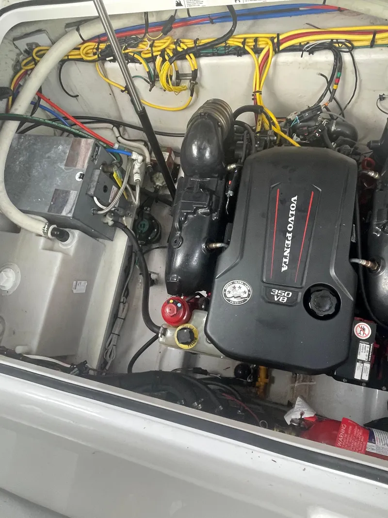 Slide: The Image of 2019 Four Winns Vista 275 engine compartment with Volvo Penta motor. - 28