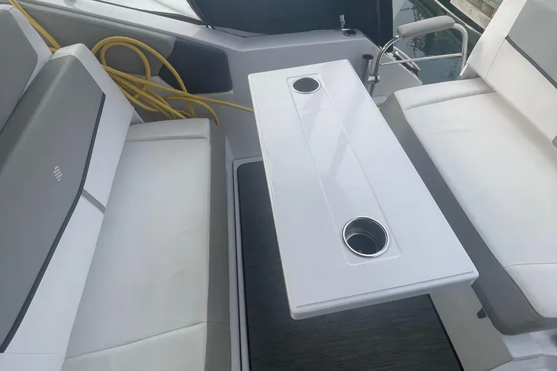 Slide: The Image of 2019 Four Winns Vista 275 boat interior with seating and table. - 29