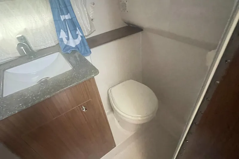Slide: The Image of 2019 Four Winns Vista 275 bathroom with sink and toilet. - 33