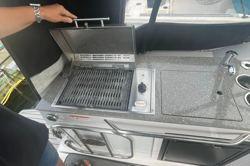 Slide: The Image of 2019 Four Winns Vista 275 boat kitchenette with grill and sink. - 38