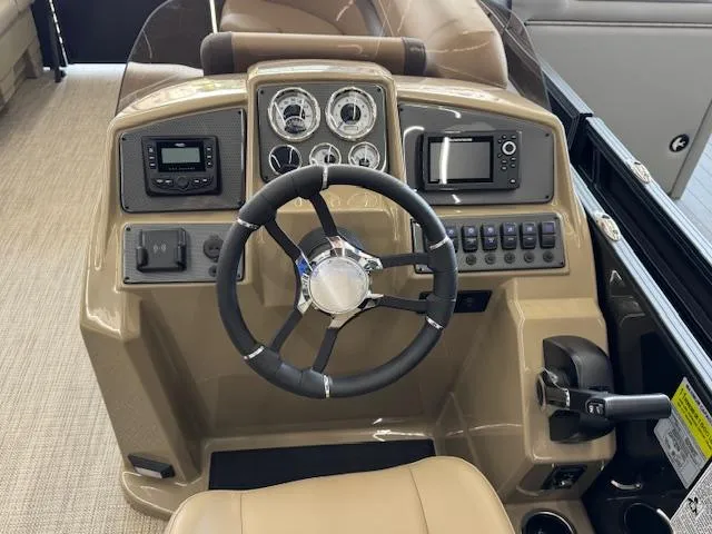 Slide: The Image of 2025 Starcraft EXS 1 boat dashboard with steering wheel and control panel. - 10