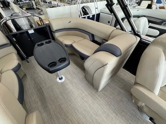 Slide: The Image of Luxurious interior of 2025 Starcraft EXS 1 boat with beige seating and table. - 13