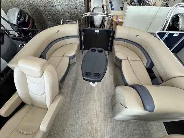 Slide: The Image of Luxurious interior of 2025 Starcraft EXS 1 boat with plush seating and central table. - 14