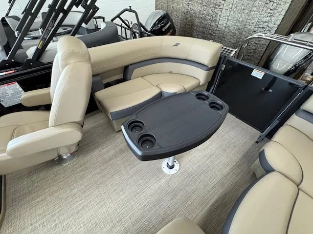 Slide: The Image of Luxurious interior of 2025 Starcraft EXS 1 boat with beige seating and table. - 15