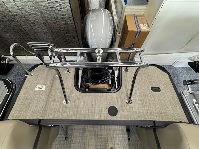 Slide: The Image of Starcraft EXS 1 boat deck, 2025 model, featuring a sleek design and modern outboard motor. - 16