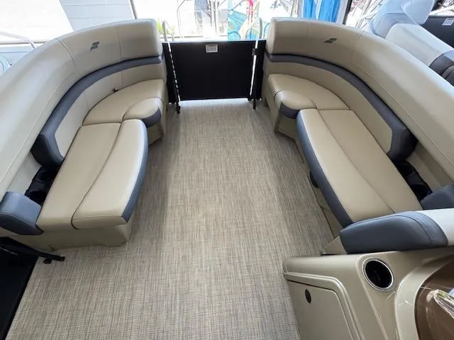 Slide: The Image of 2025 Starcraft EXS 1 boat interior with beige and gray seating, spacious layout. - 6
