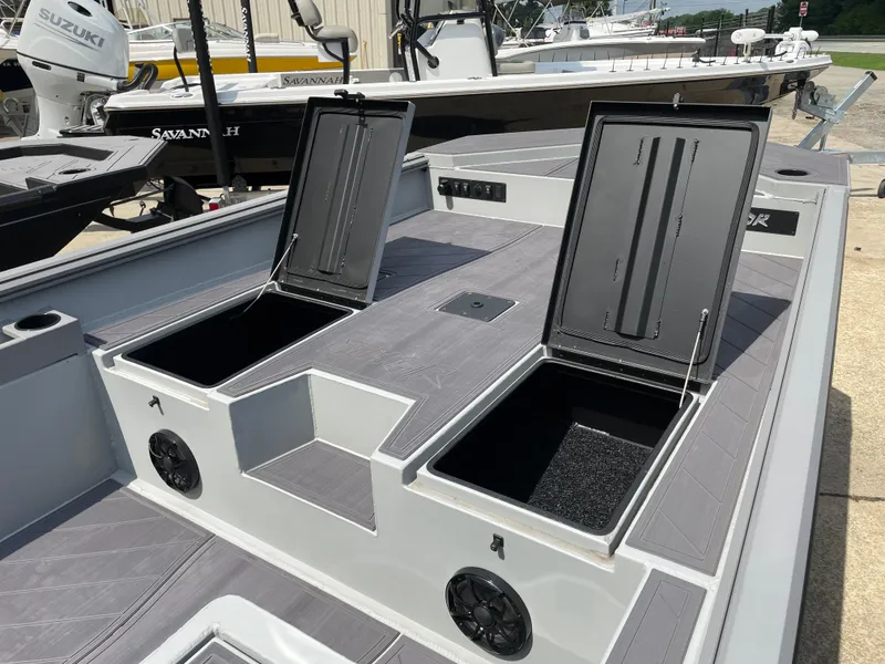 Slide: The Image of 2024 Thor 1860 Lake Hammer Side Console boat with open storage compartments. - 7
