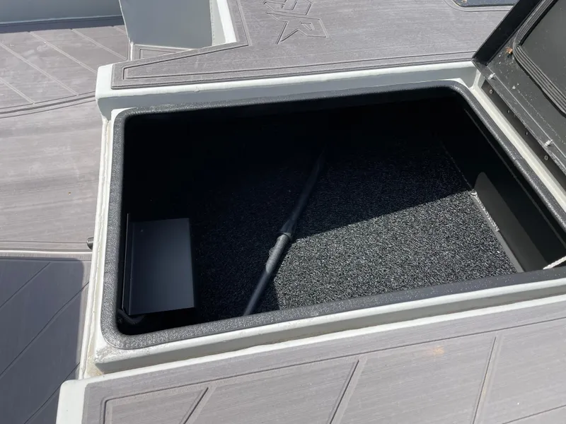 Slide: The Image of Open storage compartment in 2024 Thor 1860 Lake Hammer Side Console boat. - 8