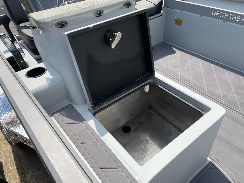 Slide: The Image of 2024 Thor 1860 Lake Hammer Side Console boat with open storage compartment. - 9