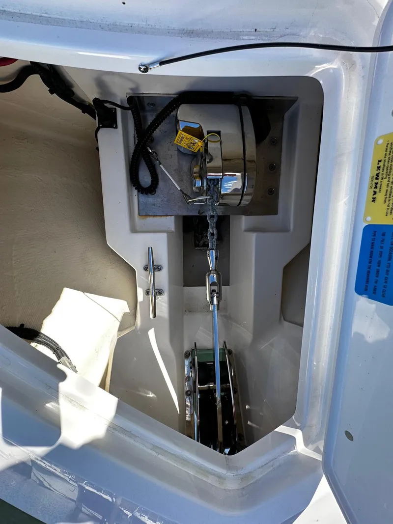 Slide: The Image of 2022 Pursuit DC 295 Dual Console anchor compartment with winch system. - 5