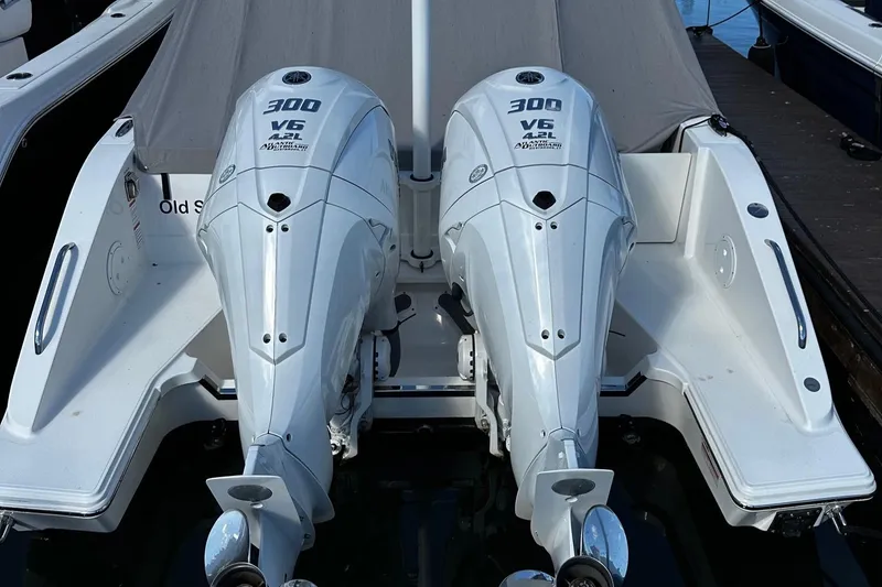 Slide: The Image of 2022 Pursuit DC 295 Dual Console with twin 300 V6 outboard engines. - 8