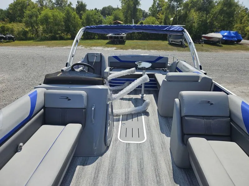 Slide: The Image of 2025 Bennington 22 SXSB pontoon boat with spacious seating and modern design. - 11