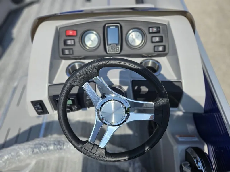 Slide: The Image of Steering wheel and dashboard of 2025 Bennington 22 SXSB boat. - 4