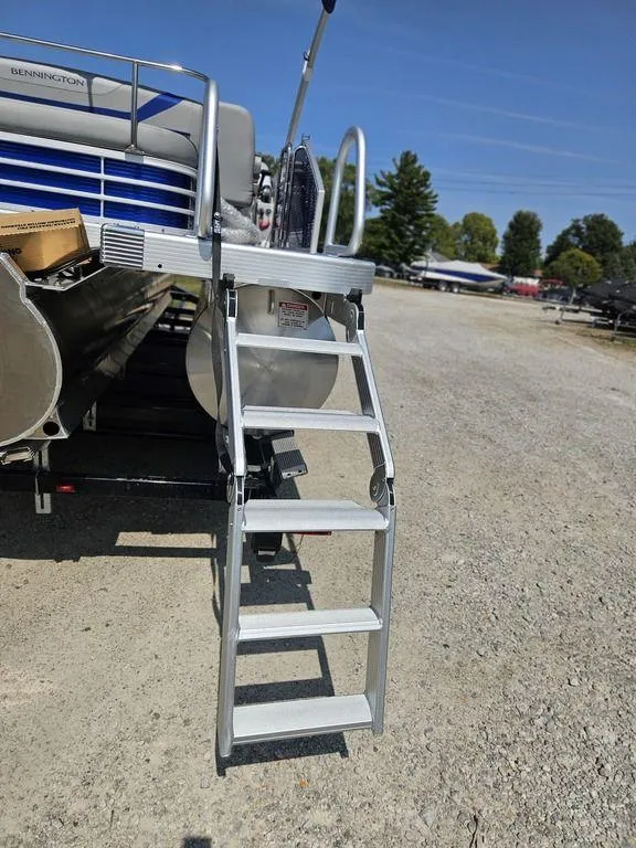 Slide: The Image of 2025 Bennington 22 SXSB pontoon boat with extended boarding ladder. - 6
