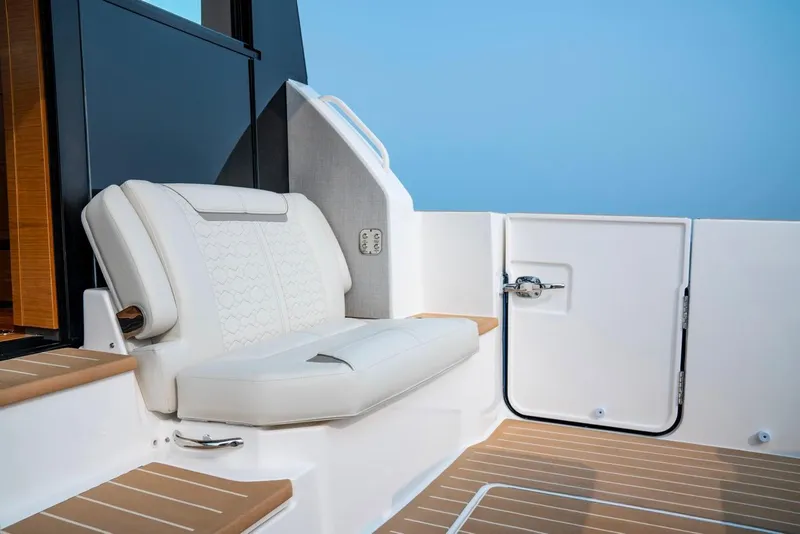 Slide: The Image of Luxury seating on 2025 Tiara Yachts 48 LE, featuring elegant design and premium materials. - 13